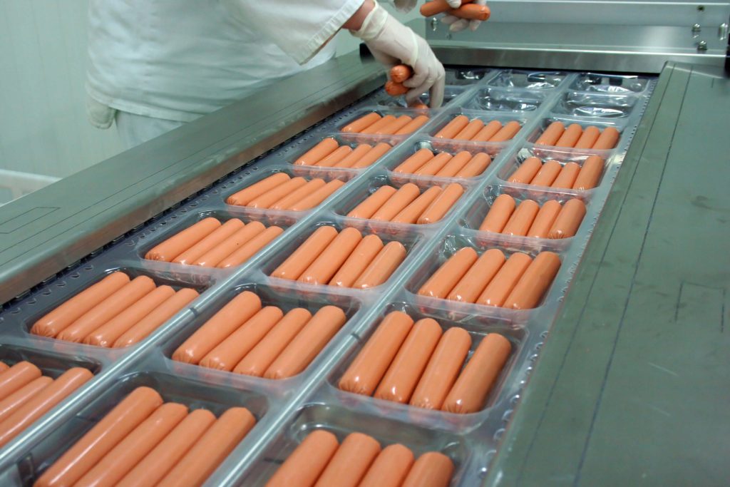 Human food being processed and packaged
